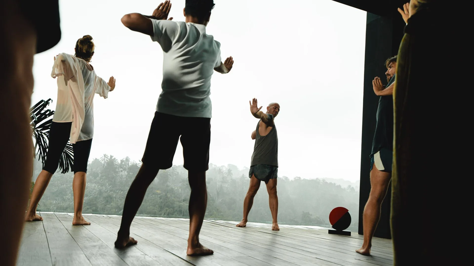 Group practice on the villa deck at dusk