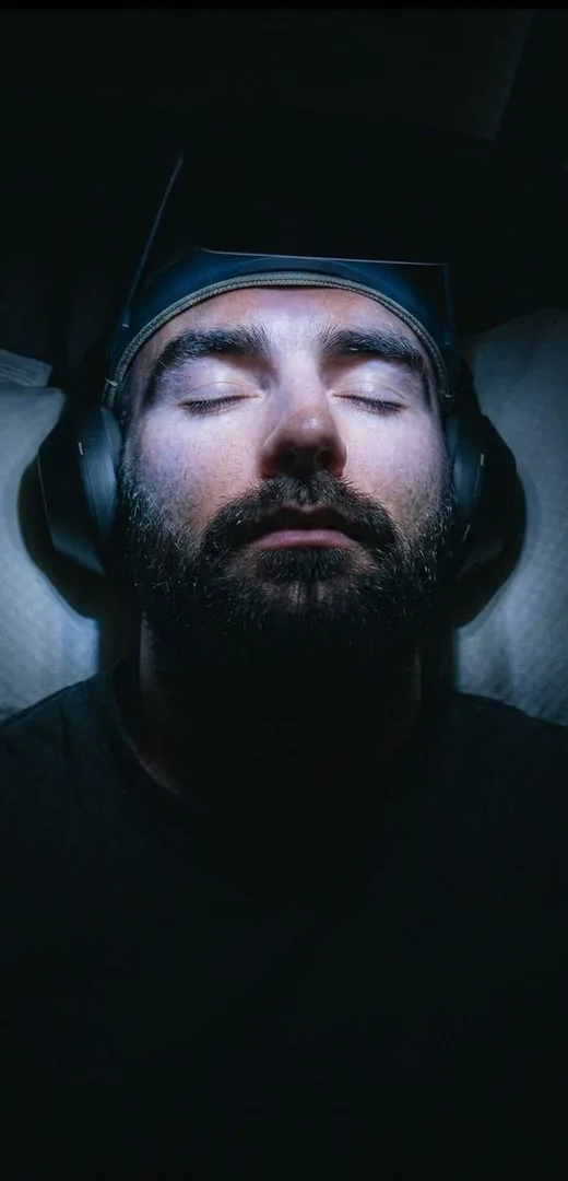 Guided light and sound therapy session, eyes closed