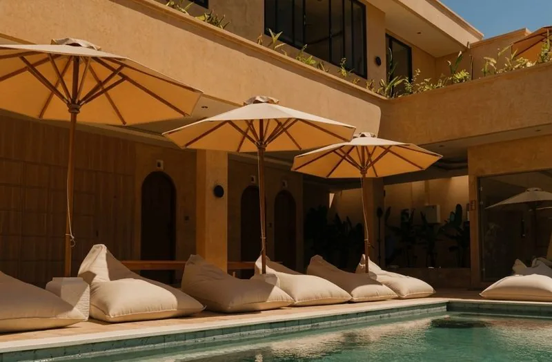 Villa pool deck with loungers and umbrellas